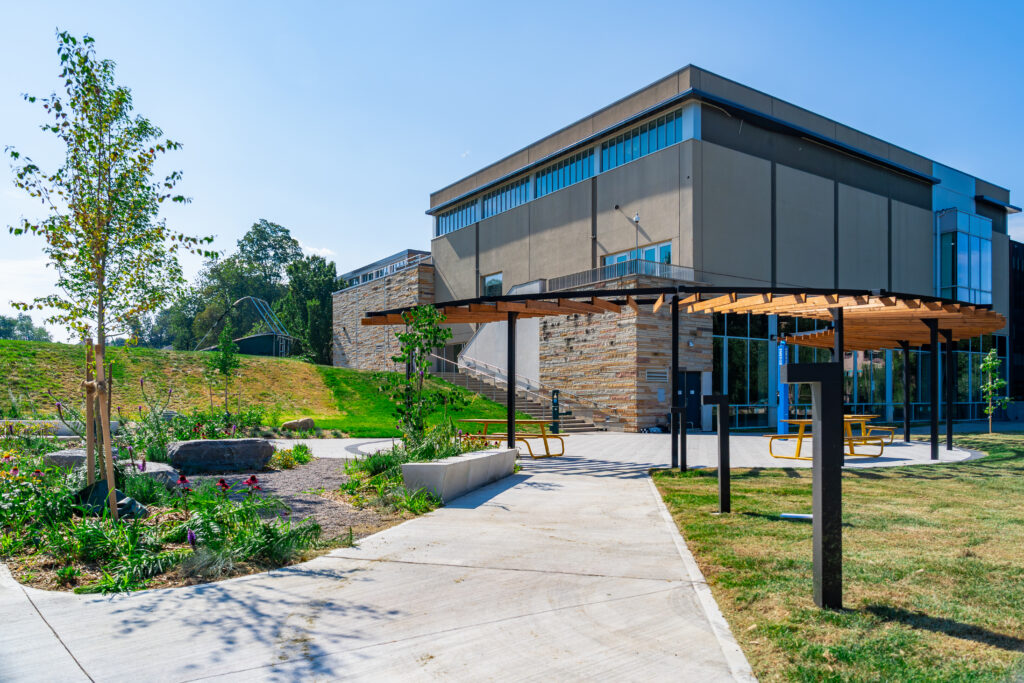 An outdoor seating area with a view toward the Athletic Centre.